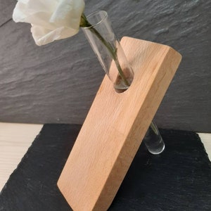 Wood with test tube as vase