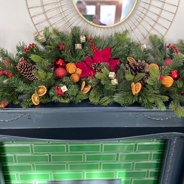 Beautiful spruce Christmas swag/Garland hand decorated with velvet poinsettia and dried oranges. 110cm x 40cm