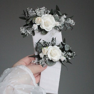 Set of white floral boutonnieres with eucalyptus and gypsophila, handmade in Ukraine.
