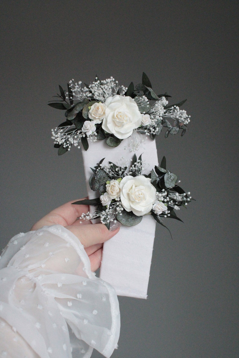 Set of white floral boutonnieres with eucalyptus and gypsophila, handmade in Ukraine.
