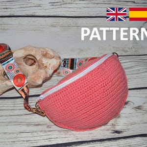 Peut inclure: Un modèle de crochet pour une banane rose avec une fermeture éclair blanche et une sangle à motifs colorés. Le modèle est disponible en anglais et en espagnol.