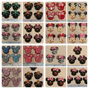 May include: A collection of 40 assorted Mickey Mouse and Minnie Mouse themed flatback cabochons. The cabochons are made of resin and feature various designs, including Mickey Mouse ears, Minnie Mouse bows, and other Disney characters. The cabochons are available in a variety of colors, including red, pink, blue, green, black, and white.