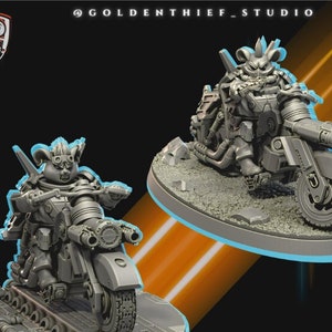May include: Two gray miniature figures of armored characters riding futuristic motorcycles. The figures are on a circular base with the text "STARBLADE DRIFTERS" in a yellow outlined rectangle. The background is dark with the Golden Thief Studio logo.