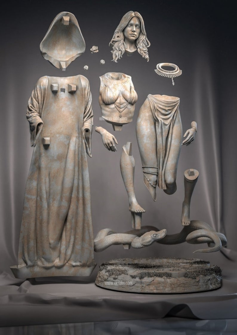 May include: A disassembled statue of a woman, with separate pieces including a head, torso, legs, arms, and a draped gown. A snake is coiled around a base. The statue is a light beige color.