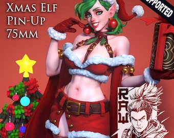 May include: A 3D-rendered image of a Christmas-themed elf pin-up figure. The figure is dressed in a red and white Santa-style outfit and holds a gift. The text "POLINA XMAS ELF PIN-UP 75MM" is visible. The figure is approximately 3 inches tall.