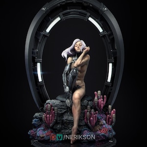 May include: A futuristic sculpture of a woman with white hair and a cybernetic arm, seated on a rock formation with coral-like structures. The figure is positioned in front of a dark, circular portal with illuminated edges. The sculpture has a detailed design.