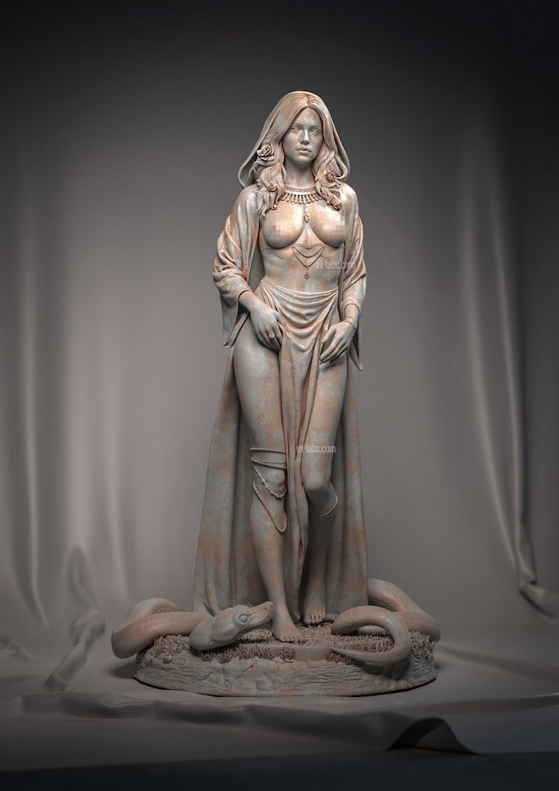 May include: A detailed sculpture of a woman with long hair, wearing a draped garment and jewelry. A rose adorns her hair. A snake is at her feet. The statue is in a neutral color and stands on a textured base.