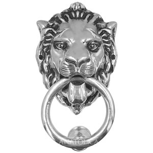 May include: Silver lion's head door knocker with a round ring. The lion's mouth is open and its tongue is sticking out.