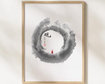 May include: Framed artwork featuring a minimalist Zen circle design in shades of gray watercolor. The artwork includes Japanese calligraphy and a small red accent. The wooden frame adds a natural touch to the piece.