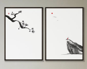 May include: Two framed black and white ink paintings. The left painting features a single branch of a pine tree. The right painting features a small figure in red standing on a rocky cliff with a red sun in the sky.