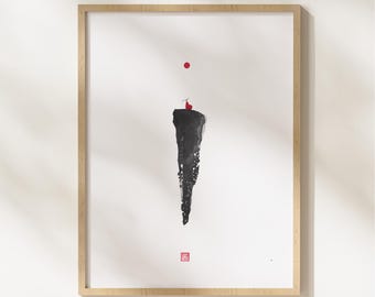 May include: Abstract art print featuring a black, brushstroke-style shape with a red dot above and a smaller red figure atop the shape. The artwork is framed in a light wood frame, set against a white background. A small red square is at the bottom.