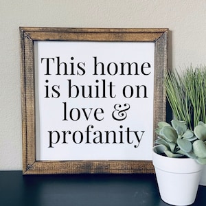 This home is built on love and profanity | funny wall sign | snarky home decor | framed canvas sign | funny home decor | sarcastic decor