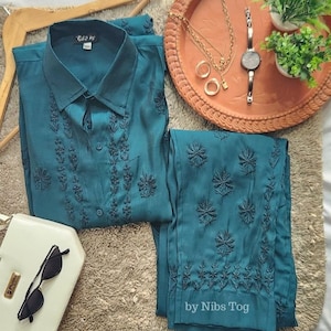Blauwgroen geborduurde chikankari-set: damespak van polykatoen