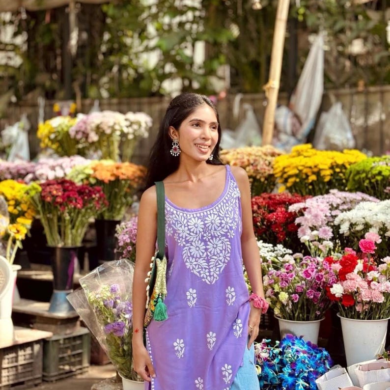 Purple cotton chikankari short kurti top with white Lucknowi embroidery, sleeveless kurti with noodle-strap design.