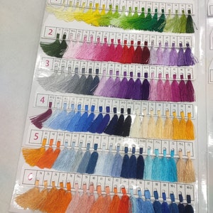 May include: A color chart of thread samples, with each color numbered and organized in rows. The chart is labeled "Neelam Thread Pvt. Ltd."