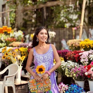 Purple cotton chikankari short top with white Lucknowi chikankari embroidery; sleeveless noodle-strap kurti.