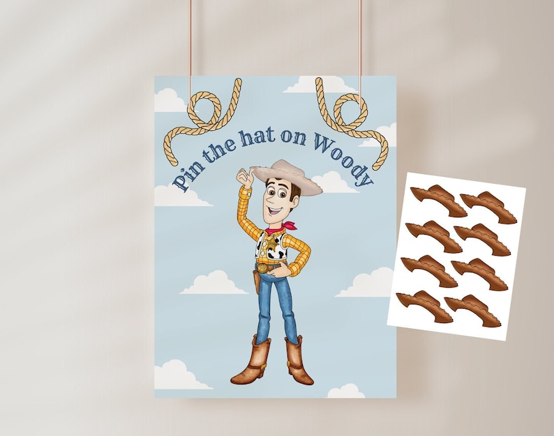 May include: Pin the hat on Woody game with a cartoon image of Woody from Toy Story. The game includes 8 brown felt hats to pin on Woody.