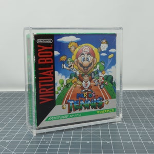 May include: A clear plastic case with a Nintendo Virtual Boy game cartridge inside. The game is Mario's Tennis, a sports game for the Virtual Boy. The game's cover art features Mario, Luigi, and other characters playing tennis on a green court.