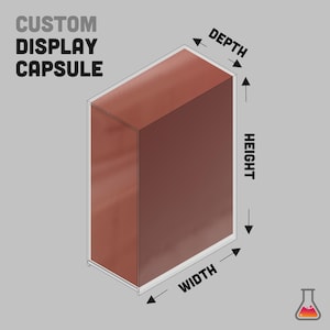 May include: A custom display capsule in a rectangular shape. The capsule is reddish-brown with a clear border. The words "CUSTOM DISPLAY CAPSULE" are printed in bold, grey letters at the top. The image also shows the dimensions of the capsule.