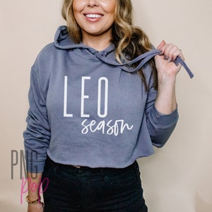 May include: A grey cropped hoodie with a white print that says "LEO season".