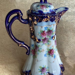 Tetera de cacao antigua de porcelana