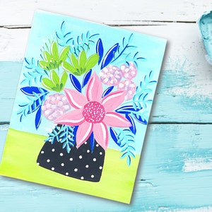 May include: A painting of a bouquet of flowers in a black and white polka dot vase. The flowers are pink, green, and blue. The background is a light blue.