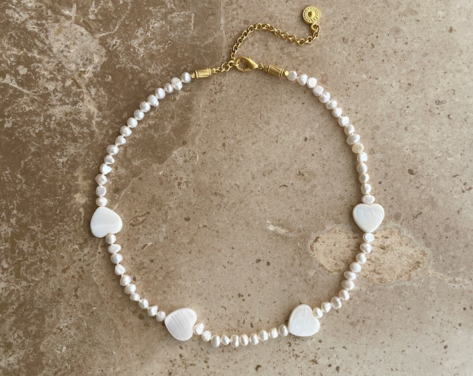 Pearl choker with shell heart charms