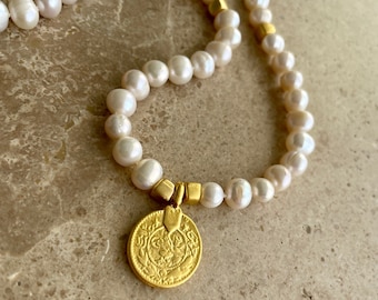 Pearl necklace with gold coin charm