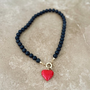 Statement black Obsidian beaded necklace with detachable large red puffy heart pendant.