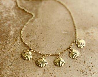 Gold plated shells multi charm necklace