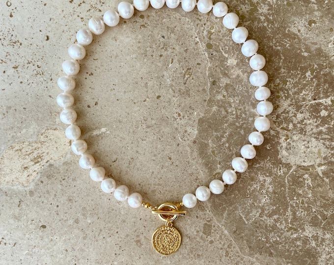 Statement pearl necklace with gold coin pendant