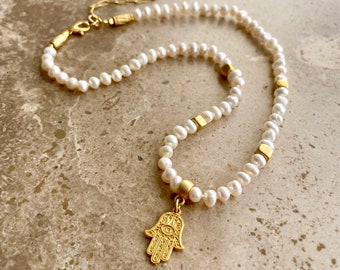 Dainty pearl necklace with gold beads and hamsa charm
