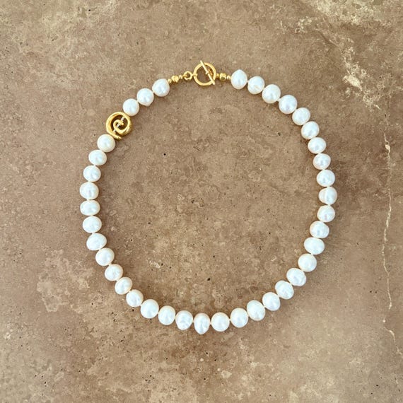 Pearl necklace with gold Greek spiral motif