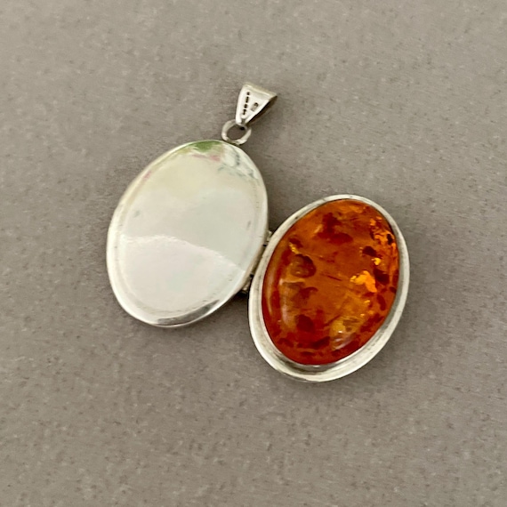 Amber and silver locket pendant
