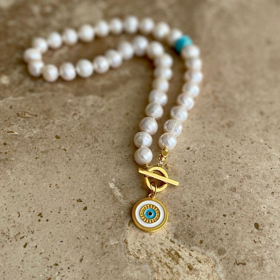 Statement pearl necklace with Greek eye pendant