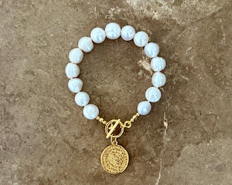 Statement pearl bracelet with T bar clasp and gold coin charm