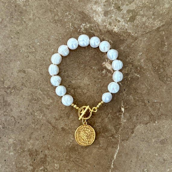 Statement pearl bracelet with gold coin charm