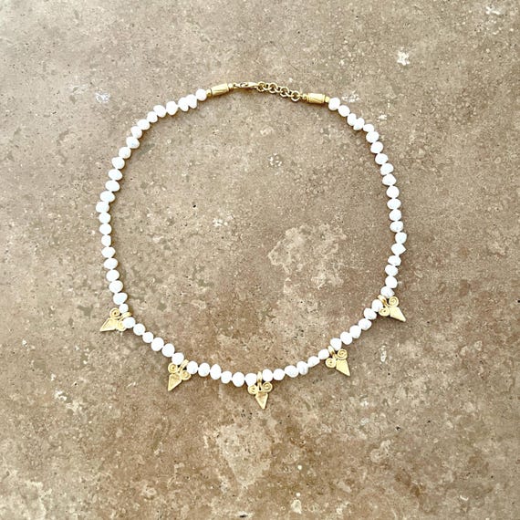 Boho style pearl necklace with gold scroll charms