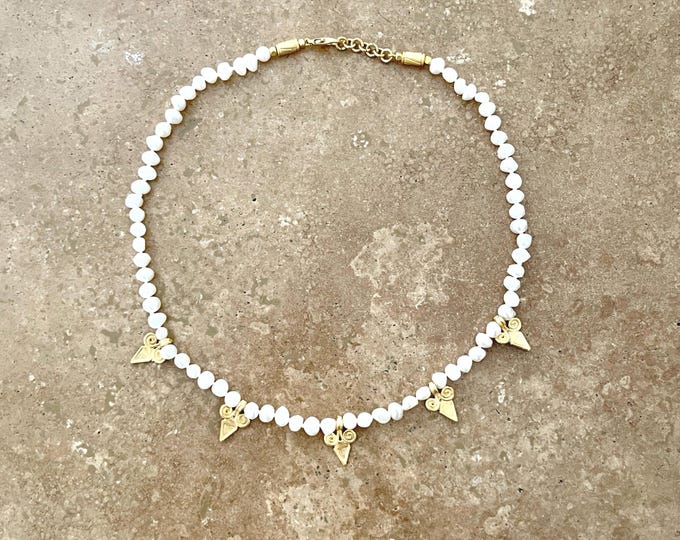 Boho style pearl necklace with gold scroll charms
