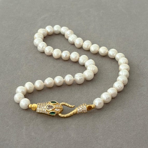 Pearl necklace with statement serpent clasp