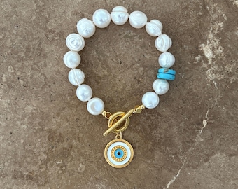 Auffälliges Perlenarmband mit griechischem Auge Charm