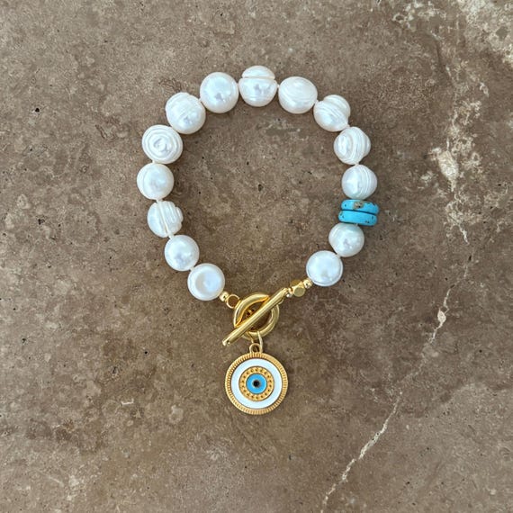 Statement pearl bracelet with Greek eye charm