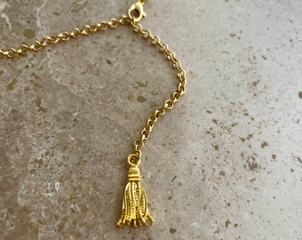 Gold belly chain with tassel charm