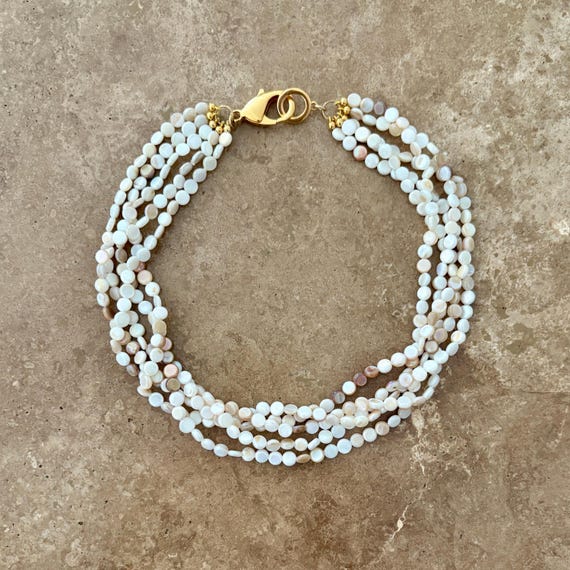 Shell bead multi strand necklace with chunky gold clasp