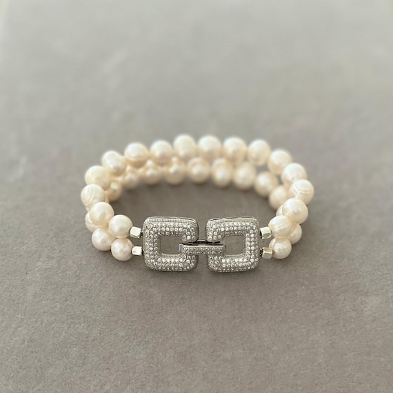 Hand knotted double row pearl bracelet with statement clasp