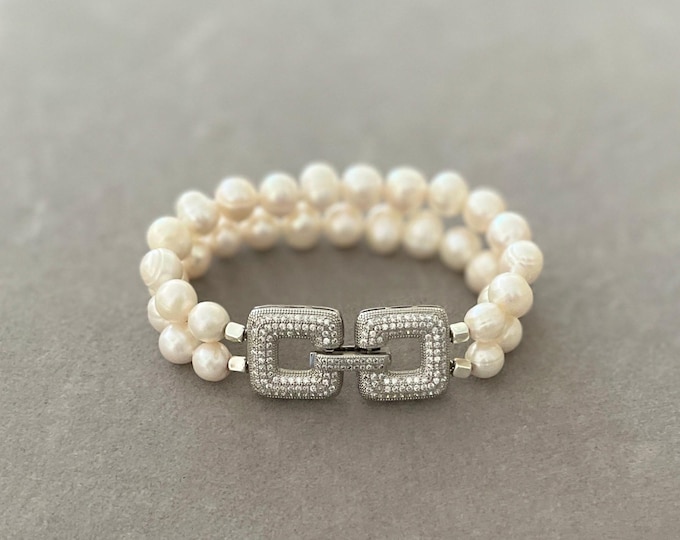 Hand knotted double row pearl bracelet with statement clasp