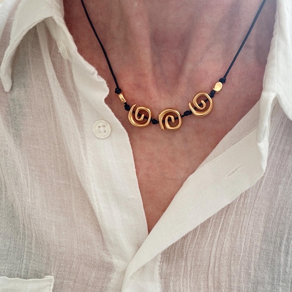 Adjustable leather cord gold spirals necklace