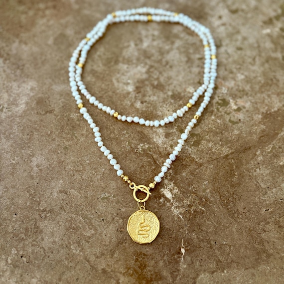 Freshwater pearl double wrap necklace with gold snake medallion