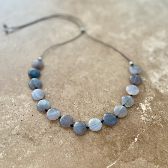 Cord necklace with silver grey agate discs