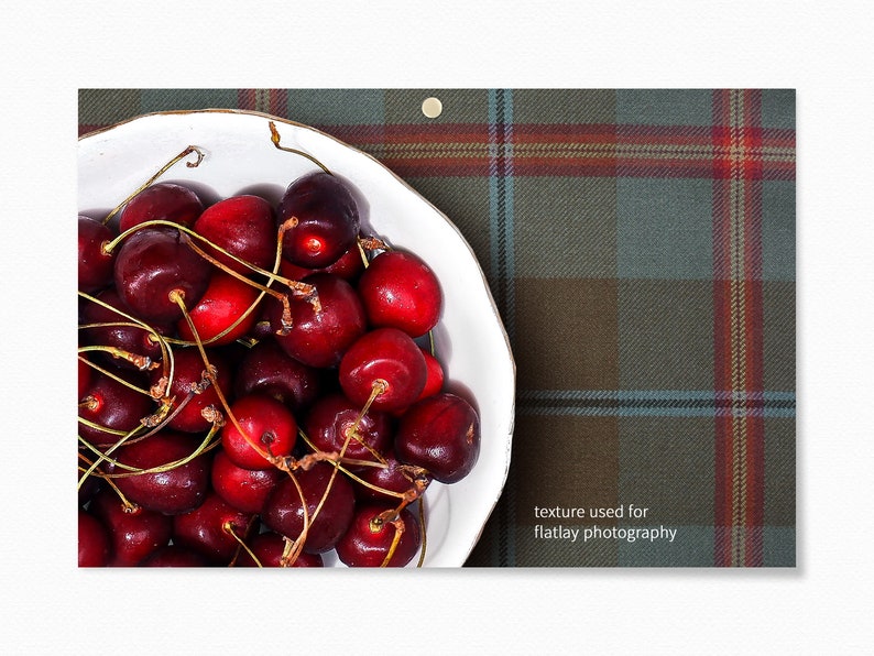 May include: A white bowl filled with bright red cherries on a green and red plaid background. The text "texture used for flatlay photography" is visible in the bottom right corner of the image.